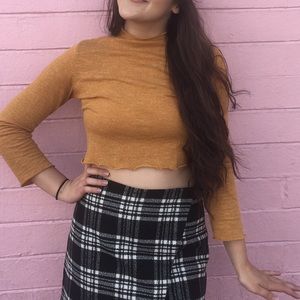 Orange mock neck lettuce edged top